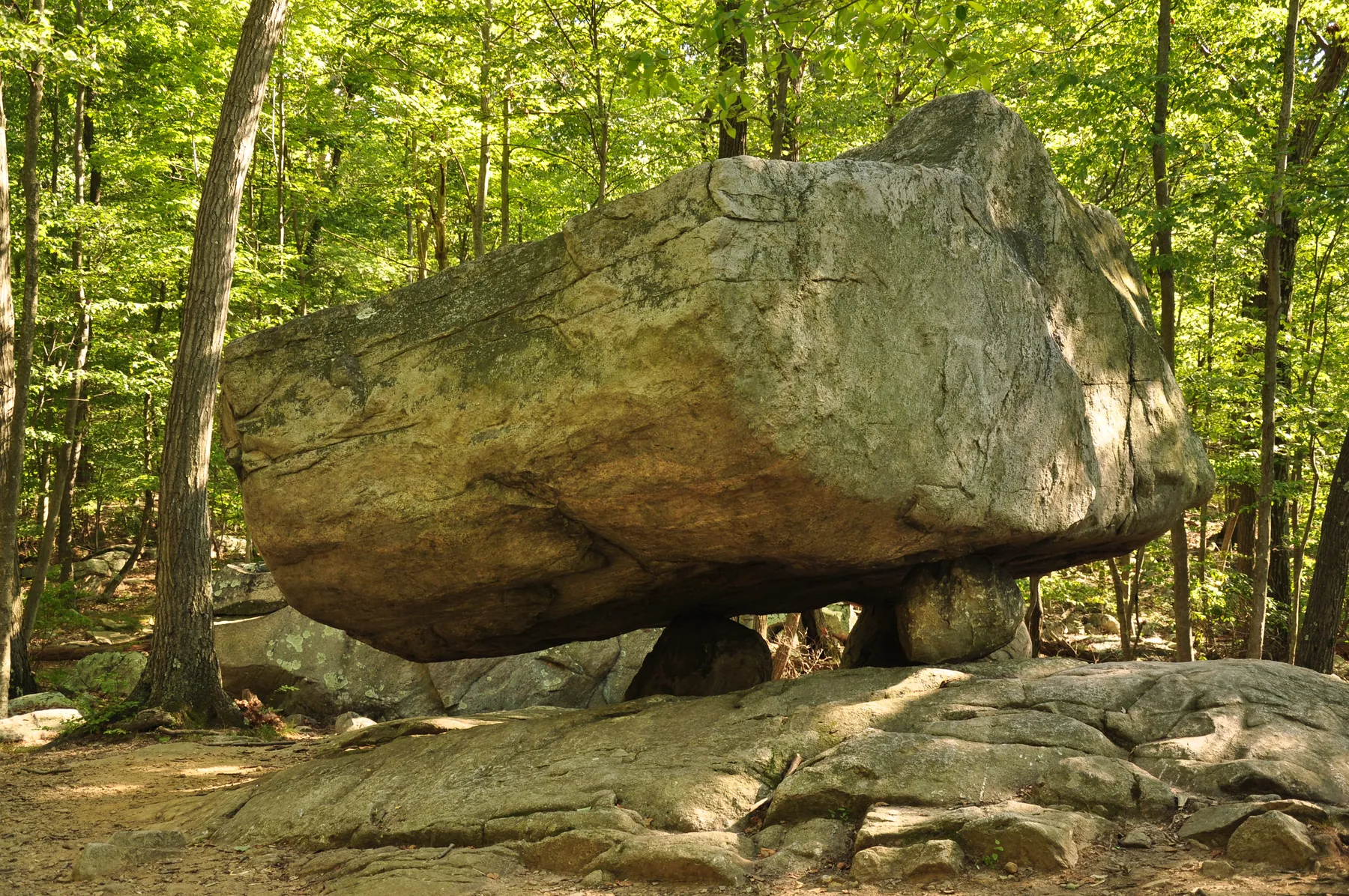 Tripod Rock — a roughly 127-tonne glacial erratic balanced on three smaller boulders along a ridge at Pyramid Mountain Natural Historic Area, Kinnelon, New Jersey.